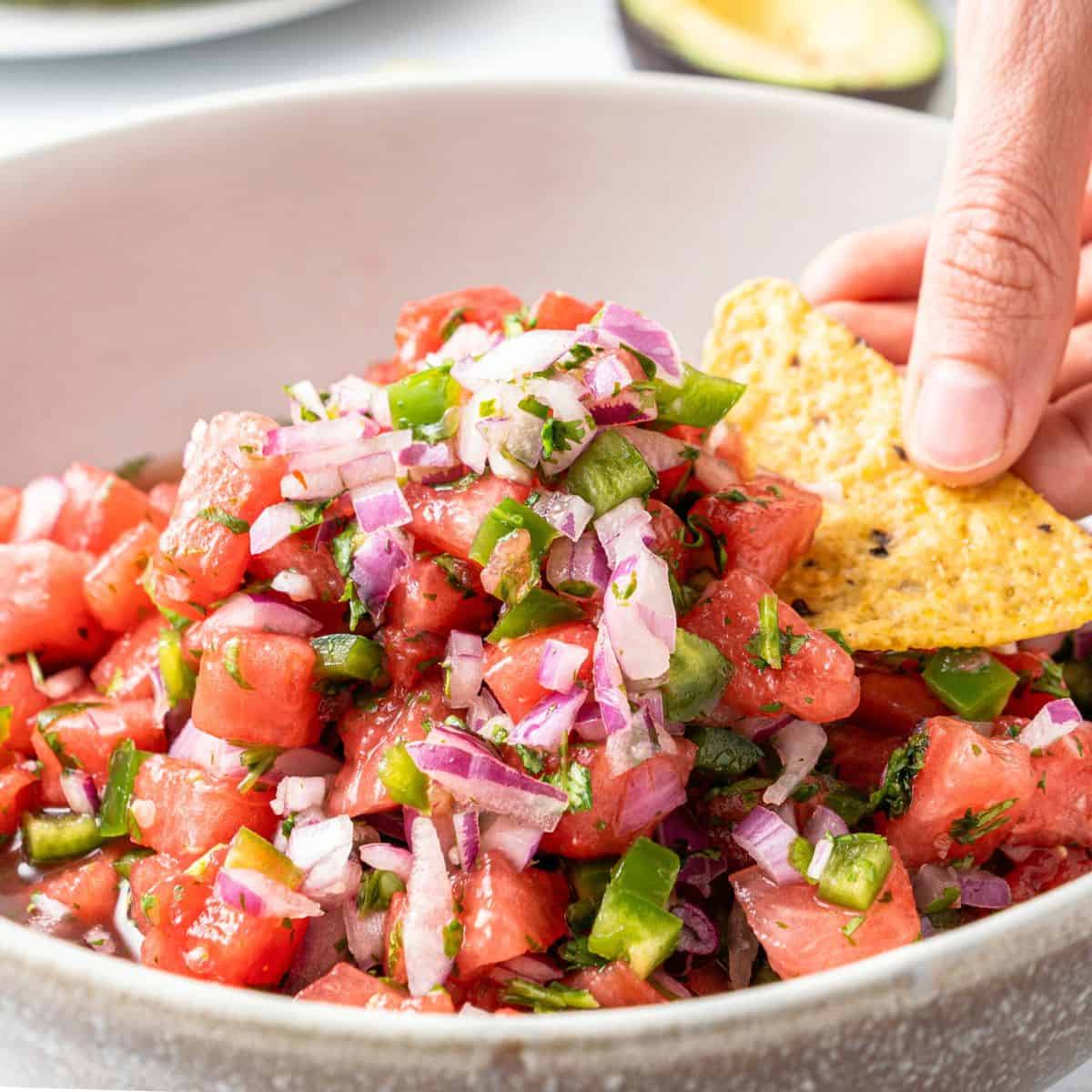 Sweet and Spicy Watermelon Salsa, a simple and delicious recipe made with fresh watermelon and with a hint of jalapeno.