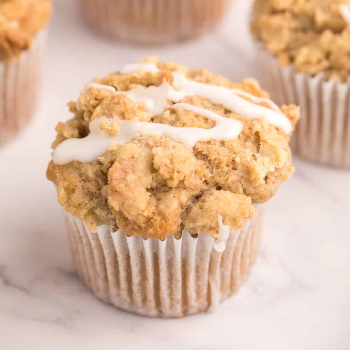 Sugar Free Cinnamon Muffins is a delicious breakfast recipe featuring a fluffy muffin topped with a crumble topping and glaze. No added sugar