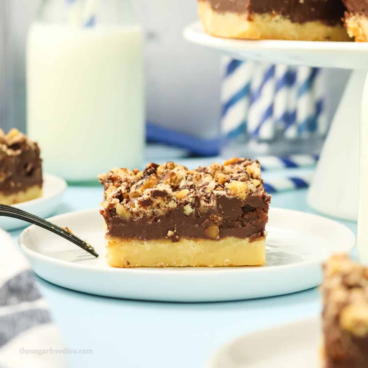 Sugar Free Chocolate Crumb Bars, a delicious no added sugar dessert recipe for creamy chocolate on buttery shortbread and topped with walnuts.