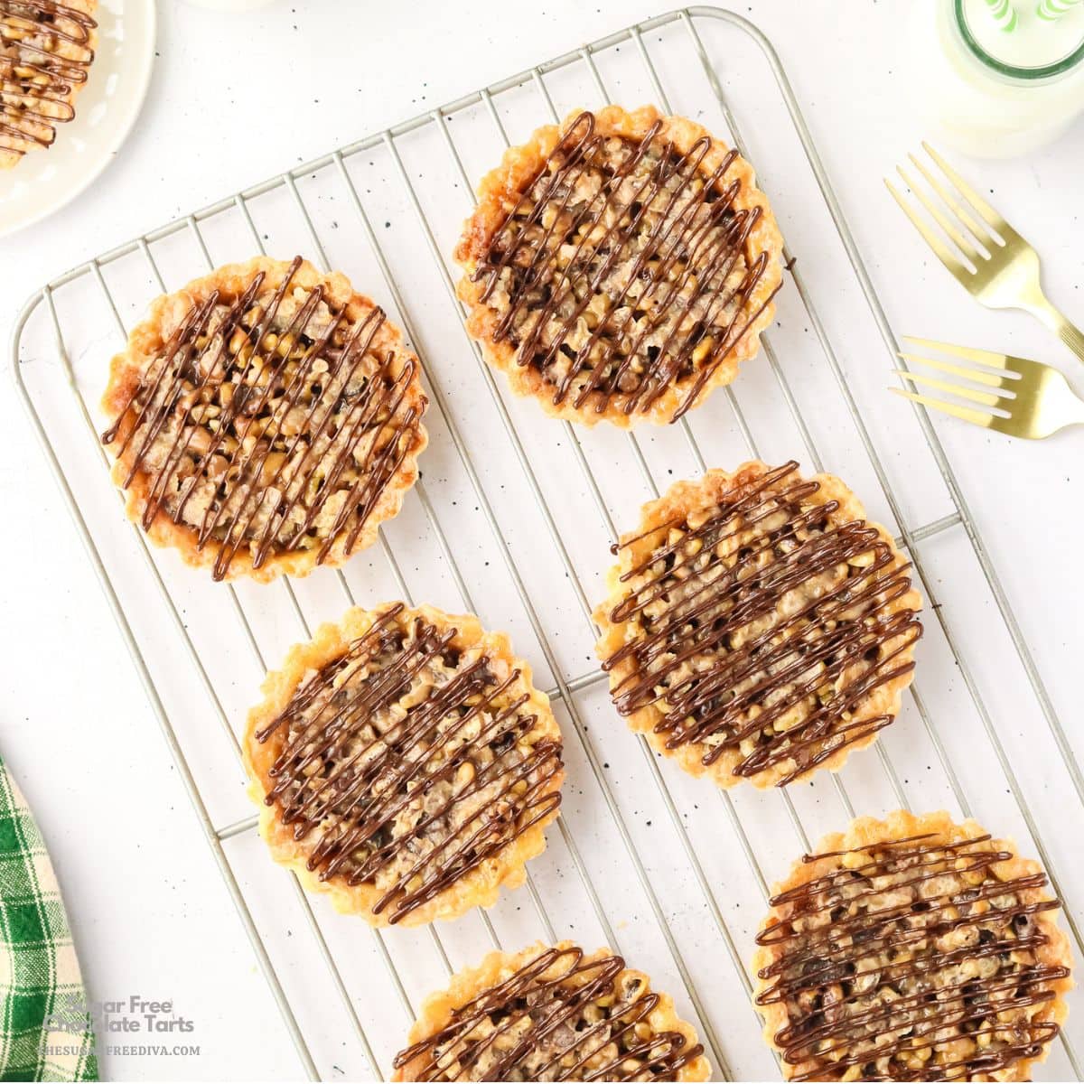 Sugar Free Chocolate Tarts, a delicious no added sugar dessert featuring buttery tart crusts filled with luscious chocolate and walnuts. Sugar Free Chocolate Tarts, a delicious no added sugar dessert featuring buttery tart crusts filled with luscious chocolate and walnuts.