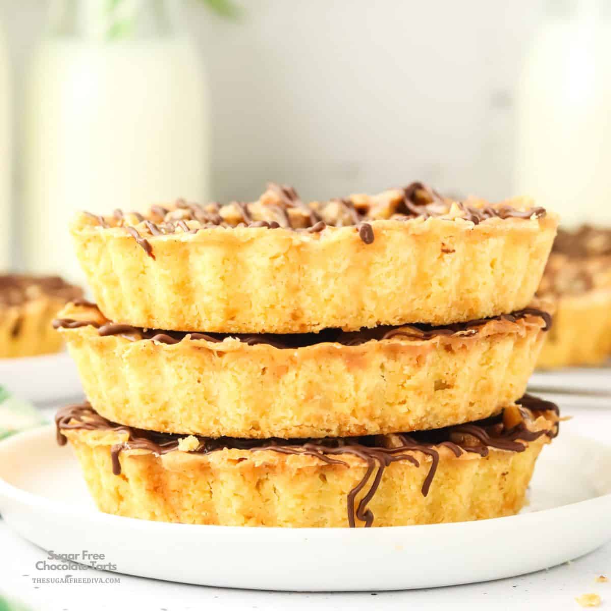 Sugar Free Chocolate Tarts, a delicious no added sugar dessert featuring buttery tart crusts filled with luscious chocolate and walnuts. Sugar Free Chocolate Tarts, a delicious no added sugar dessert featuring buttery tart crusts filled with luscious chocolate and walnuts.